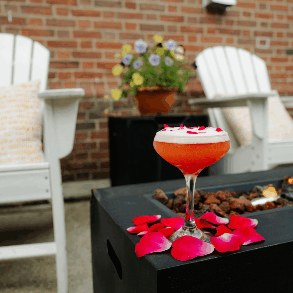 A strawberry cocktail on a table outside